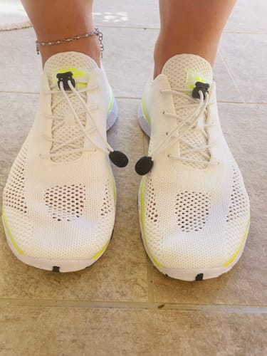 Customer's feet wearing the white Xdrain Pro Knit water shoes, showcasing the comfortable fit and elastic lacing.