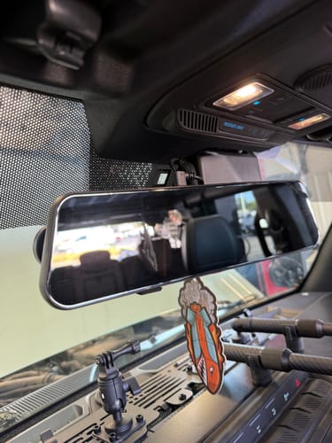 Customer's WOLFBOX G900TriPro mirror installed on the vehicle's rearview mirror housing.