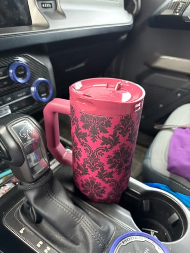 Customer's Velvet Grimoire Thicc Buddy mug with dark damask pattern in a car cup holder