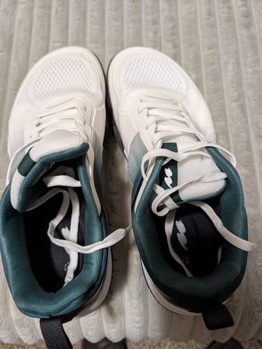 Customer's pair of white and dark green CUURT Muuv court shoes showing interior padding