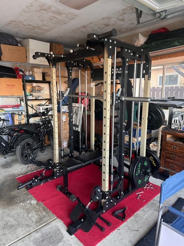 Customer's black Major Fitness B52 All-In-One Home Gym in a home garage on a red mat.