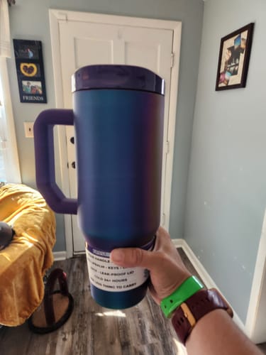 Customer's purple Thicc Buddy 40oz mug held in a hand with a label visible on the base.