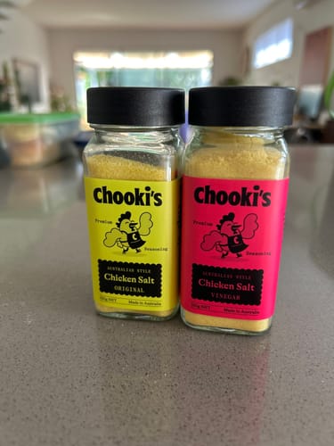 Customer's yellow and pink Chooki's seasoning shakers side by side on a countertop.