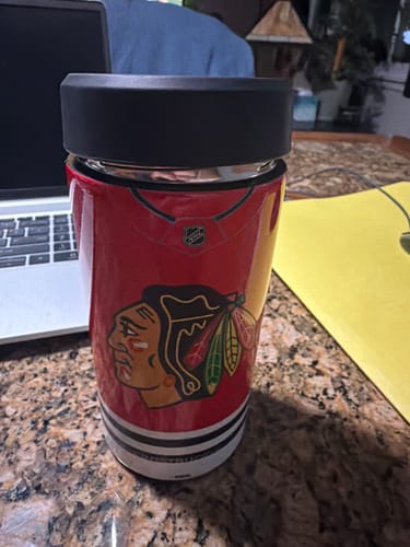 Customer's Chicago Blackhawks Universal Buddy jersey-style can cooler sitting on a granite countertop.