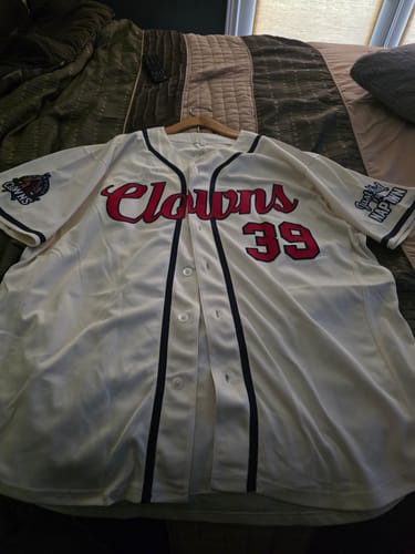 Customer's cream and navy Custom Classic Style baseball jersey, front view with Clowns logo and number 39.