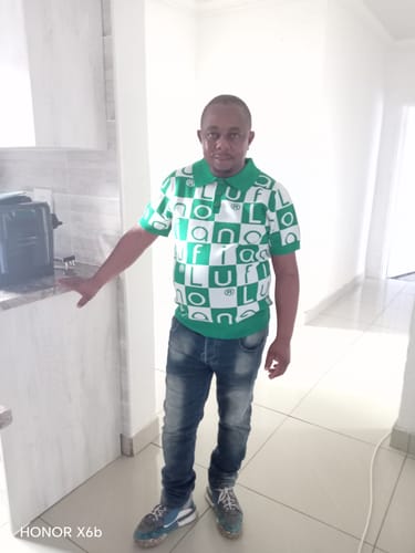Customer's LFN007 knit top in a green-white checkerboard pattern worn with blue jeans indoors.