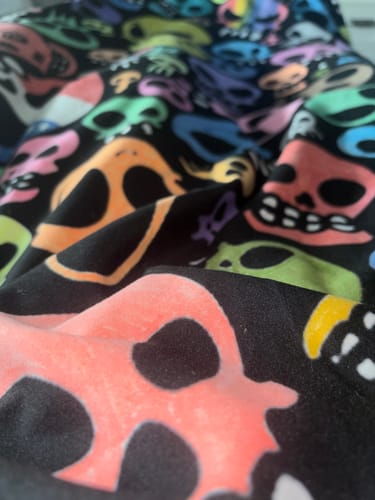 Customer's DIY Drawing Blanket featuring a pattern of colorful skulls on soft plush fabric