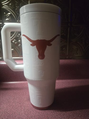 Customer's white Thicc Buddy mug featuring the Texas Longhorns logo, sitting on a counter.