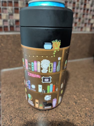 Customer's Universal Buddy cooler with a bookshelf-themed design, sitting on a countertop.