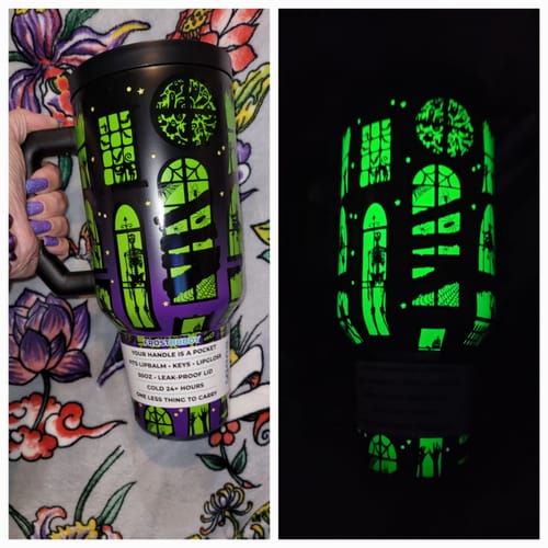 Customer's Thicc Buddy mug in normal light and glowing in the dark, showcasing Halloween-themed window designs.