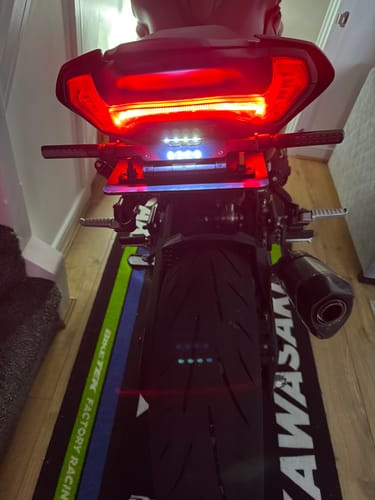 Customer's Kawasaki Z900 with a slim tail tidy installed, featuring a bright LED light setup above the rear tire.