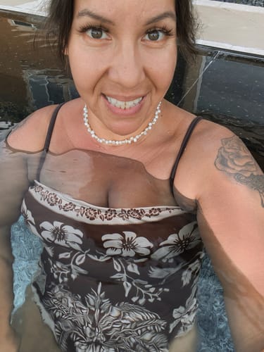 Customer's Kauai Choker worn by a person while swimming in a pool.
