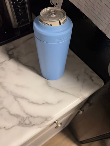 Customer's baby blue Universal XL holding a canned drink on a marble countertop.