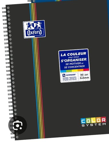 Customer's black Oxford Color System spiral notebook with color-coded stripes and informational labels on the cover.