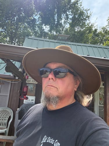 Reviewer's wide brim felt hat worn outdoors, showing front view.