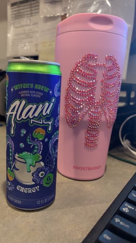 Customer's pink To-Go Buddy tumbler with a crystal skeleton design next to a blue energy drink can