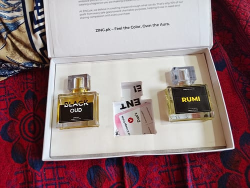 Customer's Winter Box featuring bottles of Black Oud and Rumi perfume in a white presentation box.