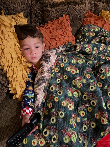 Customer photo review of Zombie vs Hunter Bamboo Quilted Blanket