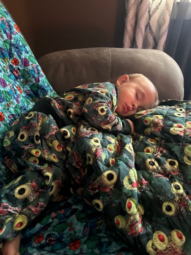Customer photo review of Zombie vs Hunter Bamboo Quilted Blanket