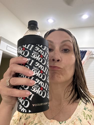 Reviewer holding a black Universal XL Coca-Cola Diet Coke insulated drink sleeve up to the camera.
