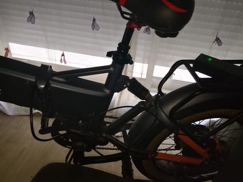 Customer's CMACEWHEEL electric bike frame and battery, showing rear rack and suspension components.