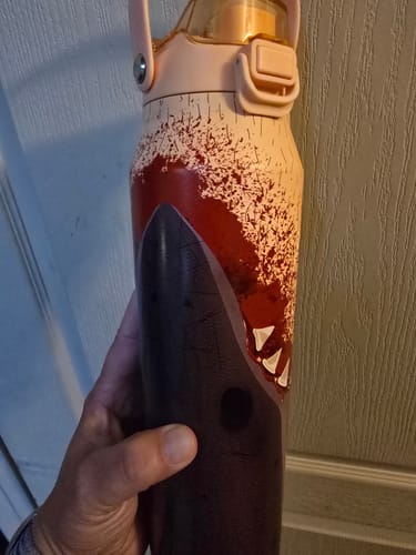 Customer's Bottle Buddy 32oz with a shark graphic, held in a person's hand.