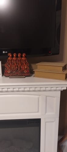 Customer's Personalized Sistas wooden plaque displayed on a white mantelpiece under a television.