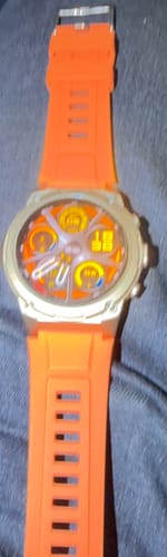 Customer's Gard Pro Ultra 3 watch featuring a bright orange silicone band and a round digital display.