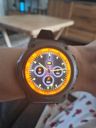 Customer's Gard Pro Ultra 3 watch on wrist, featuring a glowing orange circular display with fitness data.