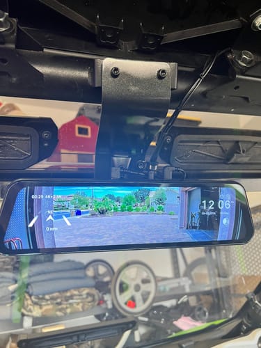 Customer's Wolfbox G900TriPro rearview mirror mounted in the Kawasaki vehicle, showing an active camera display