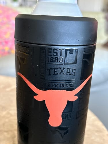 Reviewer's black Texas Longhorns Universal Buddy can cooler with a prominent orange bull logo.