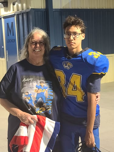 Customer's custom player shirt featuring a person wearing the personalized tee next to a football player in uniform.
