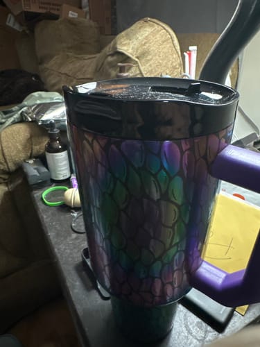 Customer's iridescent, scale-patterned Thicc Buddy cup with a black lid and purple handle.