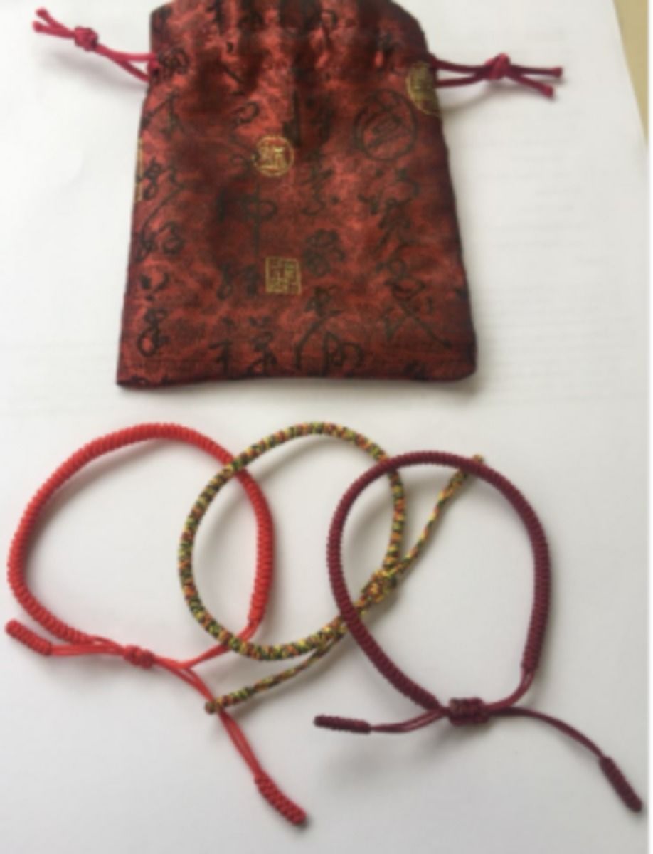 Customer photo review of Tibetan Buddhist Handmade Lucky Knots Bracelet