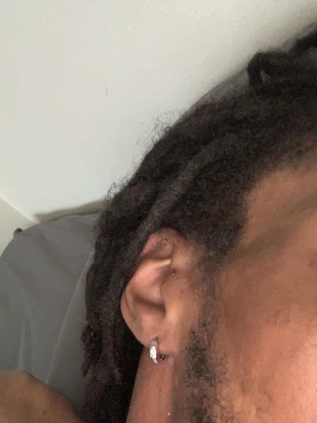 Customer photo review of White Gold Finish 1 Row Iced CZ Mini Hoop Earrings for Men