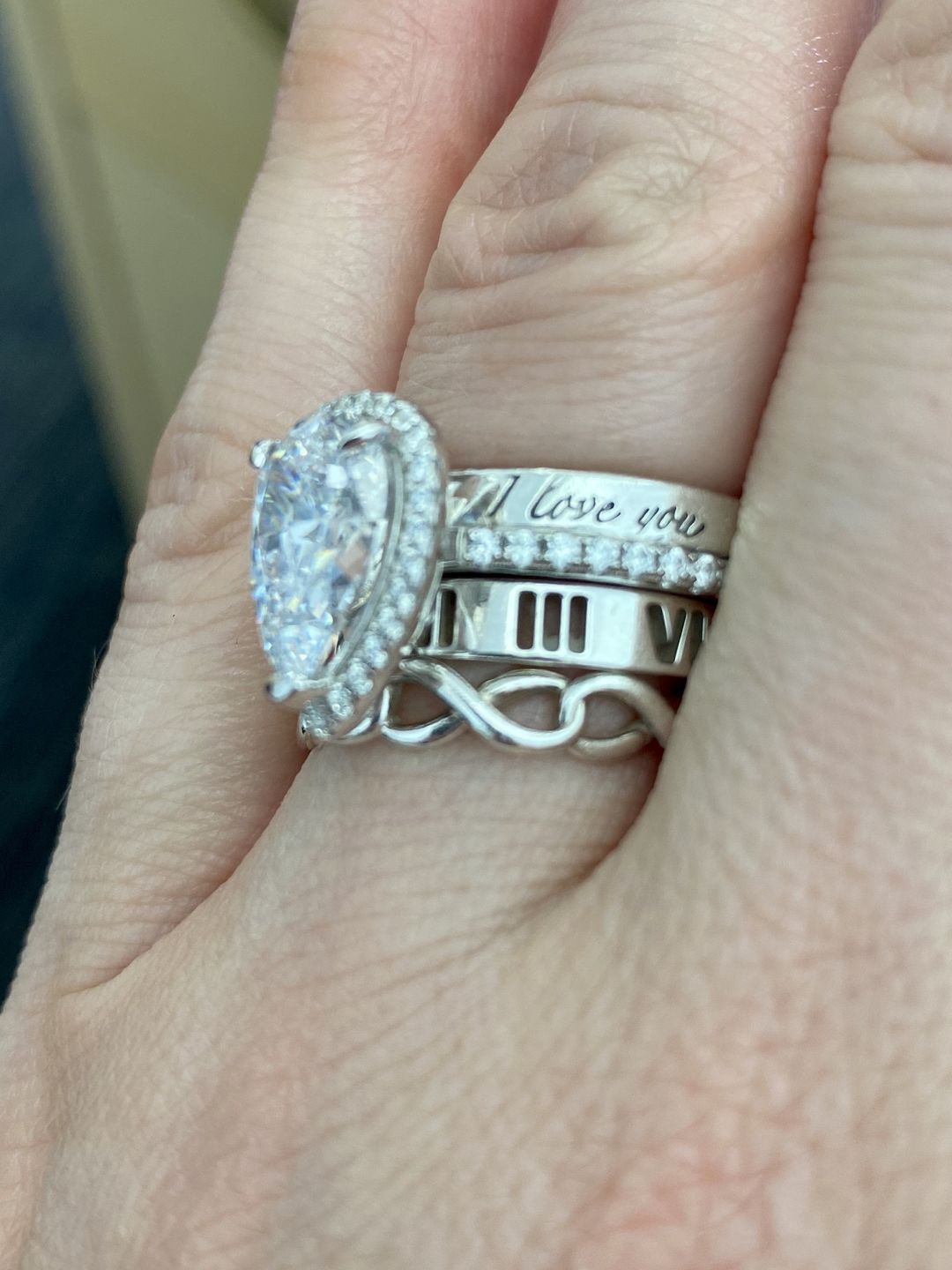 Customer photo review of Louily 5 Ct Luxury Eternity Round Cut Wedding Band In Sterling Silver