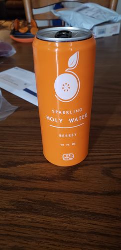 Customer photo review of Beersy "Sparkling Holy Water” Orange Silicone Sleeve For Slim Cans