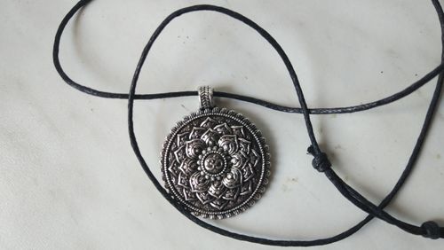 Customer photo review of Sacred Geometry Om Mandala Necklace