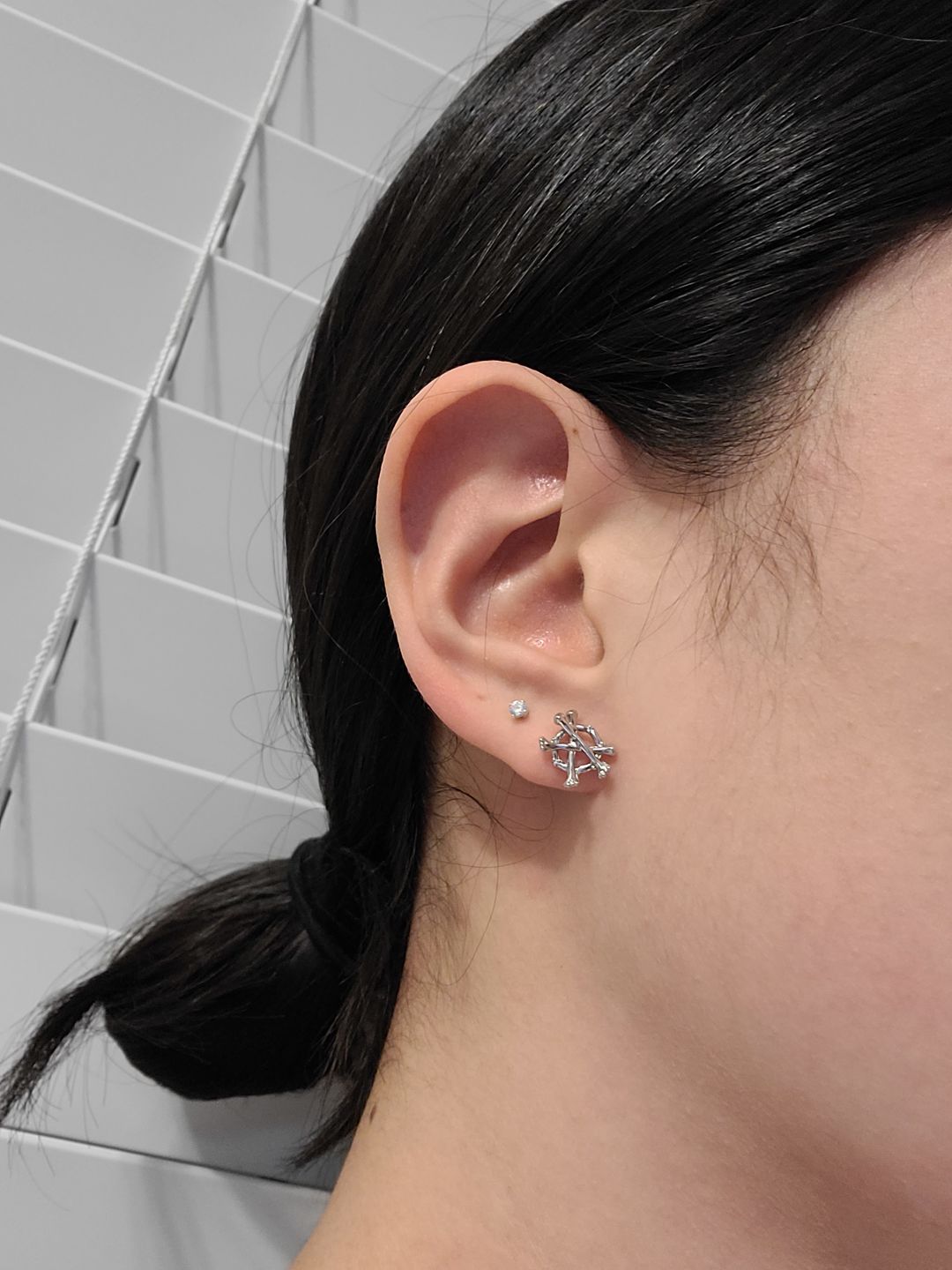Customer photo review of ANARCHY BONE EARRINGS (STUD)