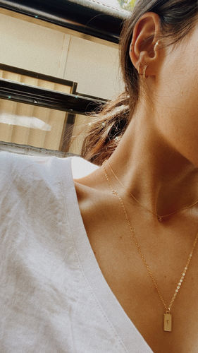 Customer photo review of Tiny Square Initial Stamped Necklace