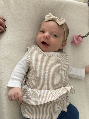 Customer photo review of Sasha romper in tan with white stripes