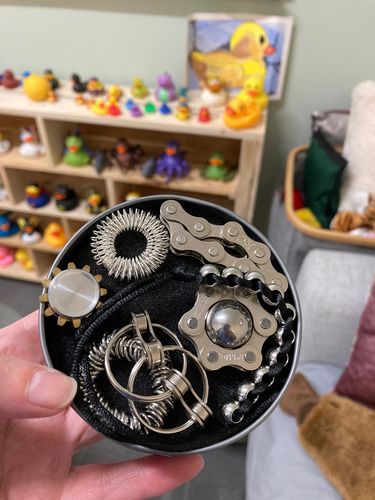 Customer photo review of "The Works"  Fidget Kit - try ALL seven best sellers in one tin!  Save $25!