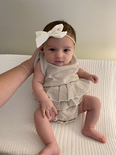 Customer photo review of Sasha romper in tan with white stripes