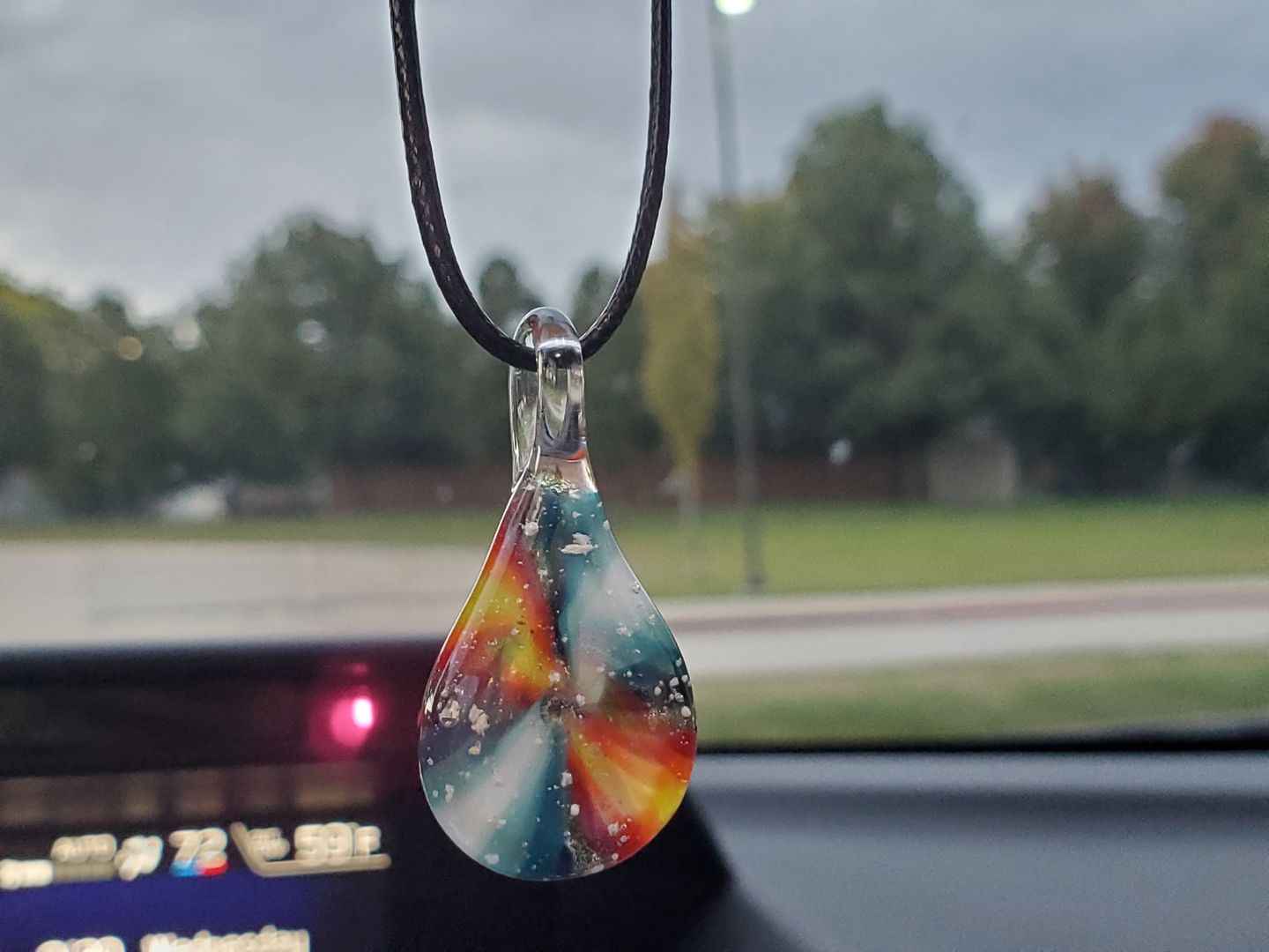 Customer photo review of Tie Dye Pendant with Infused Cremation Ashes