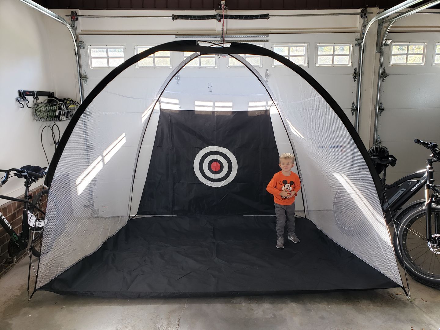 Customer photo review of Golf Practice Driving Net for Indoors and Outdoors | Tri-Turf Hitting Mat