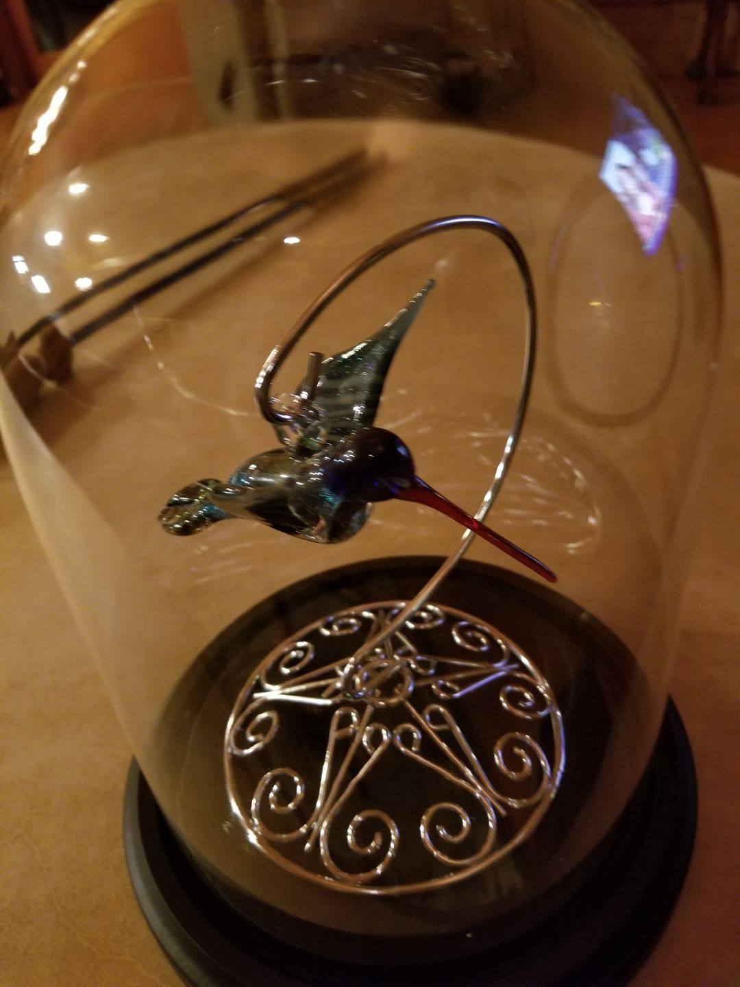 Customer photo review of Dichroic Twist Glass Hummingbird with Infused Ash