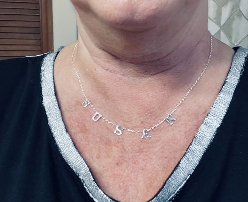 Customer photo review of The Tiny Spaced Name Necklace