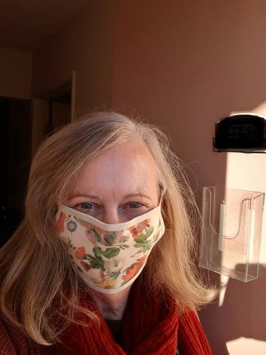 Customer photo review of Cream Floral Face Mask