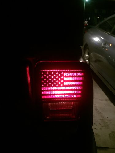 Customer photo review of Textured Black US Flag Tail Light Guards for 07-18 Jeep Wrangler JK/ JKU