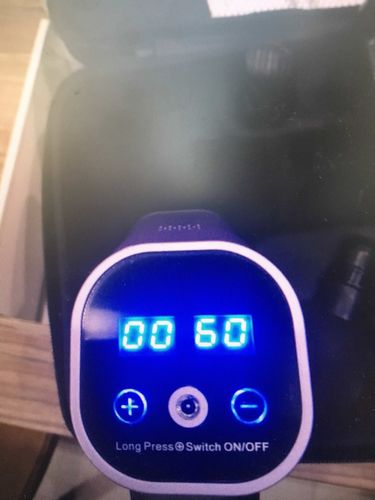 Customer photo review of 20 Speed LCD Display Muscle Massager Gun With 6 Massage Heads - More Colors